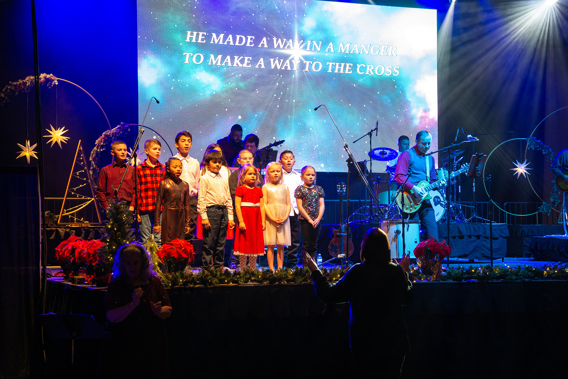 Kids Choir singing together to away in the manger